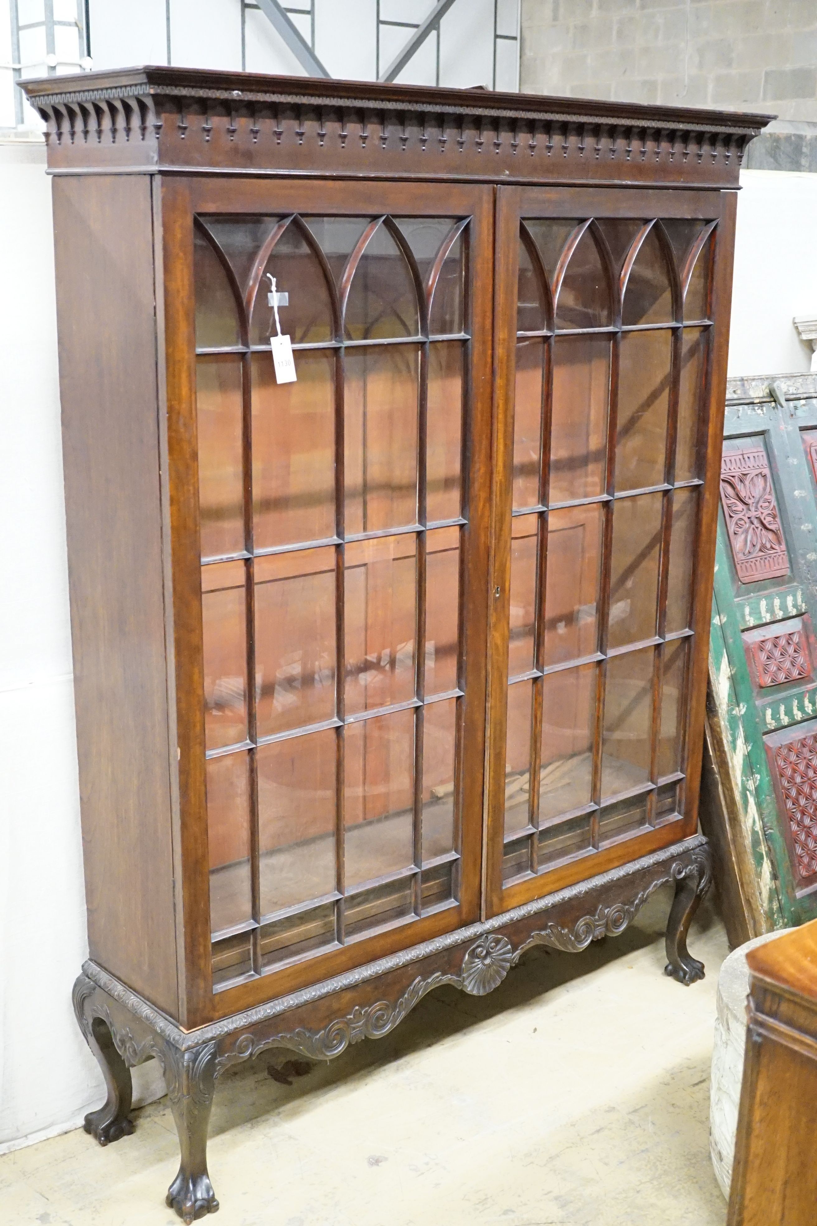 A 1920's Georgian revival mahogany bookcase, width 144cm, height 187cm